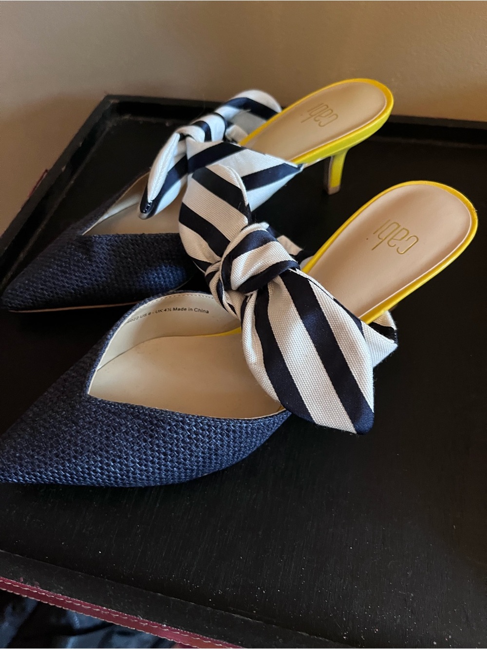 CAbi Navy Pointed Mule with Striped Black-and-White Bow and Yellow Trim